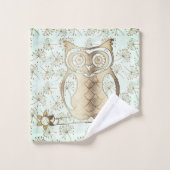 Chouette dorée sur le kit de lingerie (Gant de toilette)