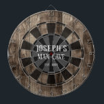 Cible De Fléchettes Grotte humaine personnalisée<br><div class="desc">Faux arrière - plan en bois avec le nom personnalisé et la grotte homme au centre de la planche. Autres couleurs disponibles dans la boutique.</div>