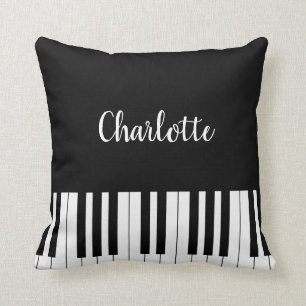 Clavier de piano, coussin noir et blanc