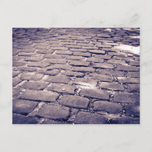 Close-up van een klinkerstraat briefkaart