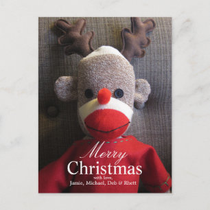 Close-up van sok aap gezicht met gewei, rood feestdagenkaart