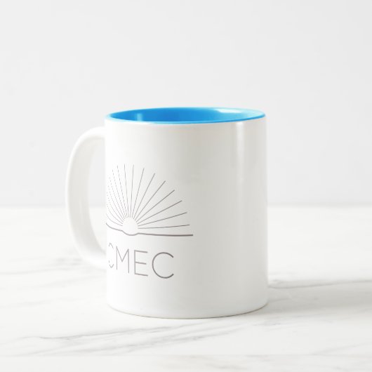 CMEC Tweekleurige Mok - grijs logo, turquoise inte (Voorkant links)