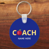 Coach-tekst met rode appel op blauw sleutelhanger (Voorkant)