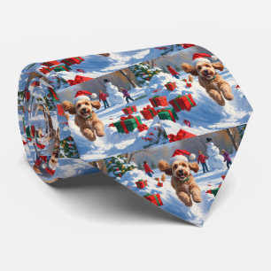 Cockapoo Rent in de Sneeuw met Kerstmuts Stropdas