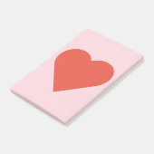 Coeur rouge sur la note de post-it rose d'arrière (Incliné)