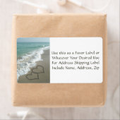 Coeurs de sable sur la plage Faveur ou Étiquette d (En situation)