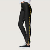 Collants noirs avec une large bande latérale dorée (Gauche)