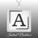 Collier Initiale personnalisée en noir et blanc<br><div class="desc">Collier personnalisé / pendentif. Ajoutez votre initiale. Jeu de couleurs : noir et blanc</div>