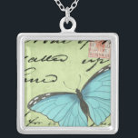 Collier Papillon à ailes bleues sur carte postale Turquois<br><div class="desc">Cette carte postale turquoise porte un message de beauté. Un délicat papillon à ailes bleues repose sur la carte,  obscurcissant une partie du script qu'il contient. Cette impression de Vision Studio ferait un grand ajout à votre maison!</div>