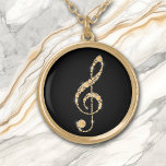 Collier Plaqué Or Faux Amber Diamond Treble Clef sur la musique noir<br><div class="desc">Magnifique, ce collier qui présente une fausse clef en diamant d'ambre d'or formée par une clé de câble. L'image est placée sur un arrière - plan noir pour un effet dramatique, mais vous pouvez facilement changer la couleur arrière - plan en la customisant. Parfait pour l'élève, l'enseignant ou l'interprète de...</div>