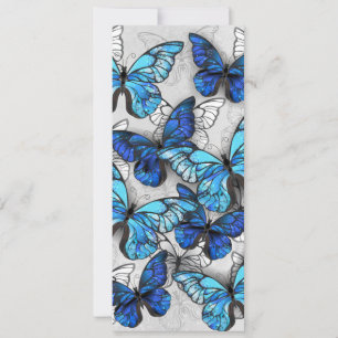 Compositie van witte en blauwe vlinders aankondiging