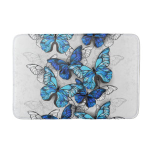 Compositie van witte en blauwe vlinders badmat