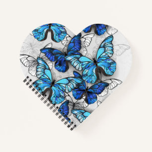 Compositie van witte en blauwe vlinders notitieboek