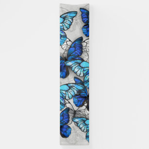 Compositie van witte en blauwe vlinders spandoek