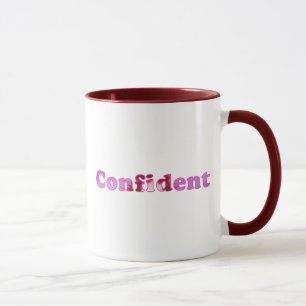 Confiance épelée avec des tasses de fleurs roses