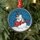 Cool Guitariste Snowman Ornements<br><div class="desc">Cet ornement de Noël met en scène un bonhomme de neige cool, aux teintes foncées, qui joue de la guitare dans la neige. Cet ornement aurait l'air d'être accroché à votre sapin de Noël, à votre rétroviseur, ou comme un ventilateur de plafond. Ajoutez un cordon plus long et portez-le comme...</div>
