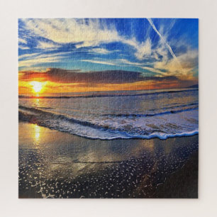 Coole zonsondergang op het strand legpuzzel
