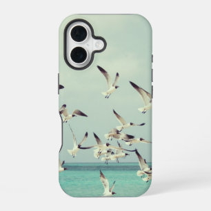 Coque iPhone 16 Mouettes volant au-dessus de l'océan