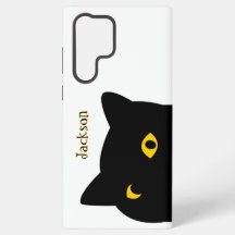 Le chat noir vous regardant avec des yeux dorés pe