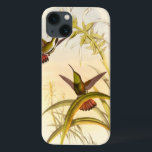 Etui iPhone 13 Deux colibris colorés visant pour la même fleur<br><div class="desc">L'artiste John Gould était passionné au sujet des oiseaux. Dans ce dessin coloré, les deux colibris et la fleur sont représentés admirablement. Les détails en ces beaux-arts colorés enchanteront n'importe quel amant d'art.</div>
