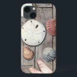 iPhone 13 Coque Les trésors marins<br><div class="desc">Megan Meagher est connue pour ses oeuvres d'art simples. Cette image montre la simplicité des trésors du bord de mer, dont les dollars de sable et les coquillages dans un ton pastel. Meagher embrasse à son image un arrière - plan en bois pour contraster ces trésors. Obtenez cette impression fine...</div>