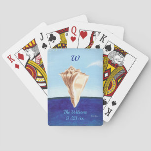 Coquillage de conch et cartes de jeu de Monogramme