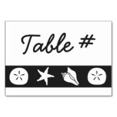 Coquillages d'été sur carte de table noire (Dos)