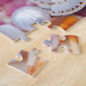 Coquillages sur le puzzle de la plage (Côté)