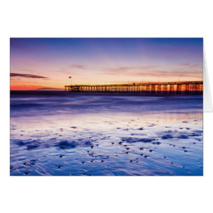 Coucher de soleil sur la jetée et la plage de Vent