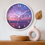 Coucher de soleil violet océan nuages photo modern<br><div class="desc">S'inspirer chaque fois que vous regardez l'heure sur cette horloge murale photographique d'un magnifique coucher de soleil mauve, rose et bleu, à la lumière douce sur l'océan Pacifique. Vous avez le choix entre un visage rond ou carré. Fait un grand cadeau de ménage! Vous pouvez facilement personnaliser cette horloge murale....</div>