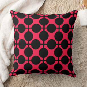Coussin à damiers géométriques rouges et noirs et pois