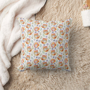 Coussin à motif de chat roux et de fleurs