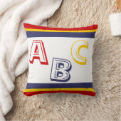 Coussin ABC bleu, jaune et rouge marine sur blanc (Couverture)