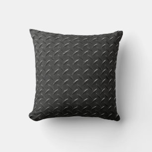 Coussin Acier noir, texture métallique floutée.