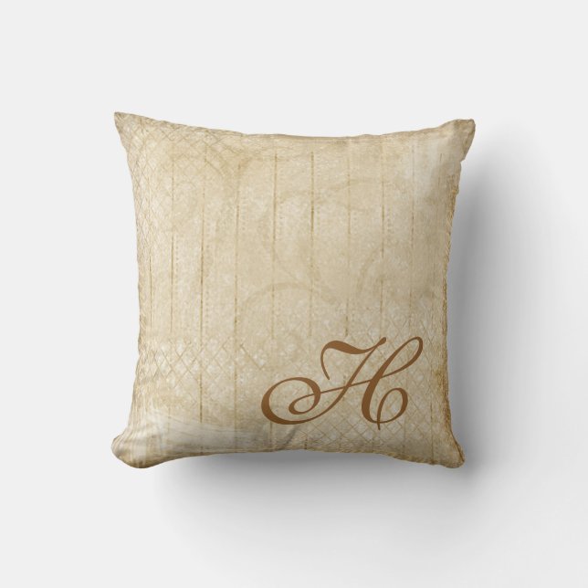 Coussin affligé de décor de monogramme d'or et de (Recto)
