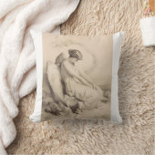 Coussin ange chrétien assis sur une pierre (Couverture)