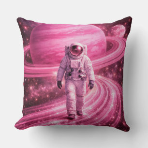 Coussin Astronaute marchant sur des anneaux roses