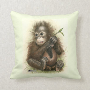 Coussin Bébé d'orang-outan avec le feuille