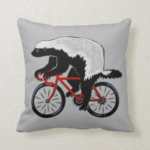 Coussin Blaireau de miel sur une bicyclette