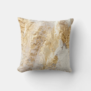 Coussin Brosse d'or blanc à texture peinte.