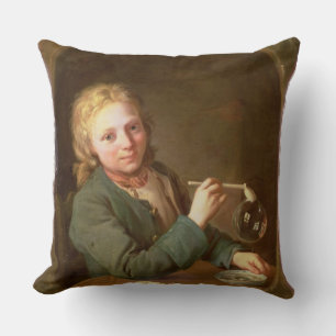 Coussin Bulles de soufflement de jeune homme d'un tuyau