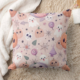 Coussin Citrouilles et fantômes d'Halloween sur rose sans