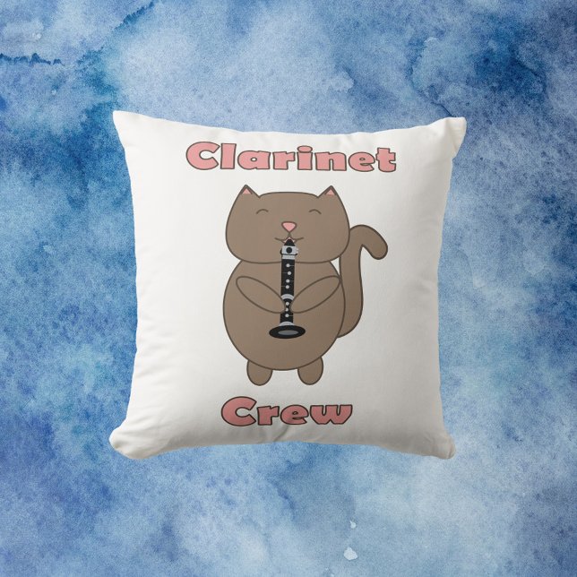 Coussin Clarinet Crew rose Brown Chat amusant (A throw pillow with a brown cartoon cat playing the clarinet with the words clarinet crew in pink.)