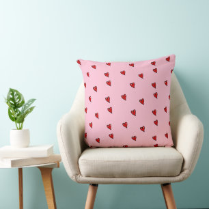 Coussin Coeurs brillants rouges sur rose