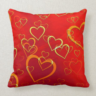 Coussin Coeurs d'or et d'oranges sur l'oreiller rouge