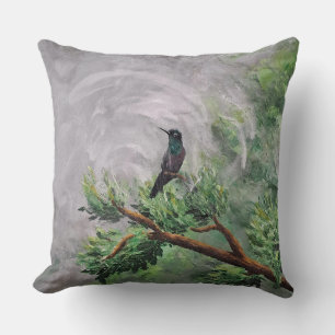 Coussin Colibri perché sur une branche de feuilles