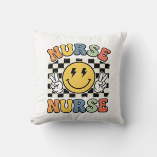 Coussin Conception de chemise à carreaux Smiley d'infirmiè