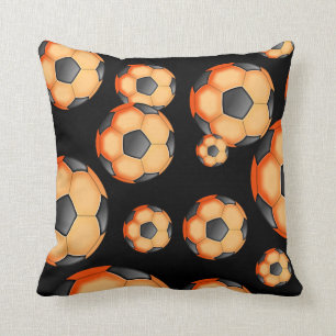 Coussin Conception noire et orange du football