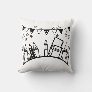 Coussin crayons, règles, effaceurs et livres