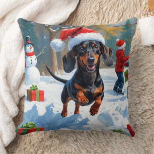 Coussin Dachshund courant dans la neige avec un chapeau de
